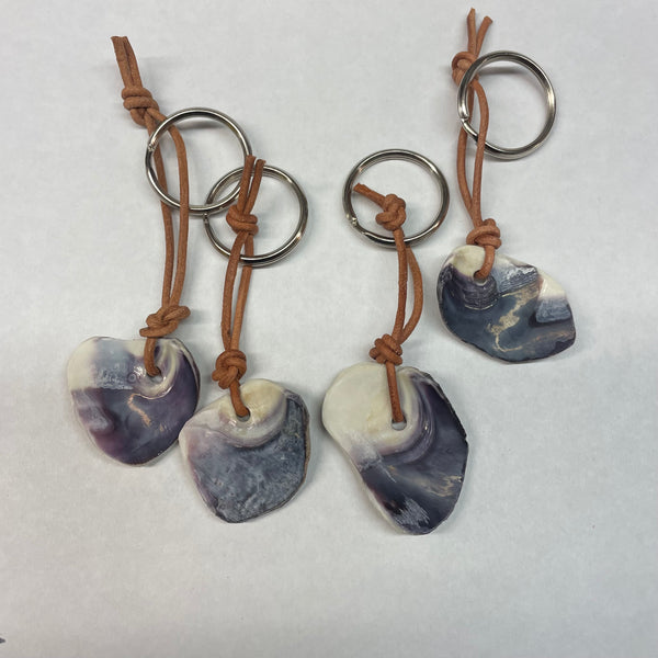 One Keychain Quahog shell Wampum hand made. Shell carvings vary.
