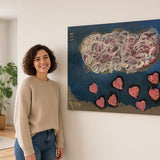 Cloud of Hearts — unique person holding canvas